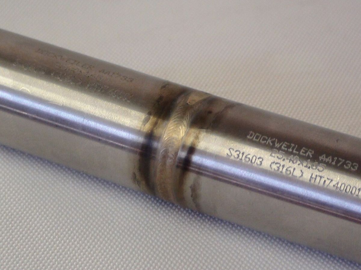 Close-up of a TIG weld seam on metal plate